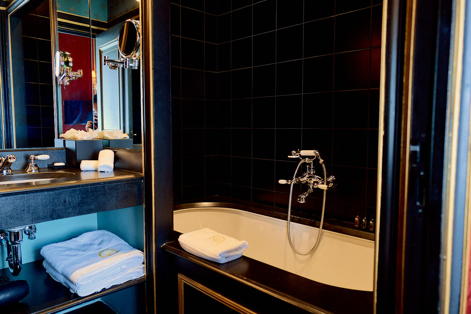 Maison Souquet The bathroom packs in a soaking tub on one side and a rainfall shower on the other