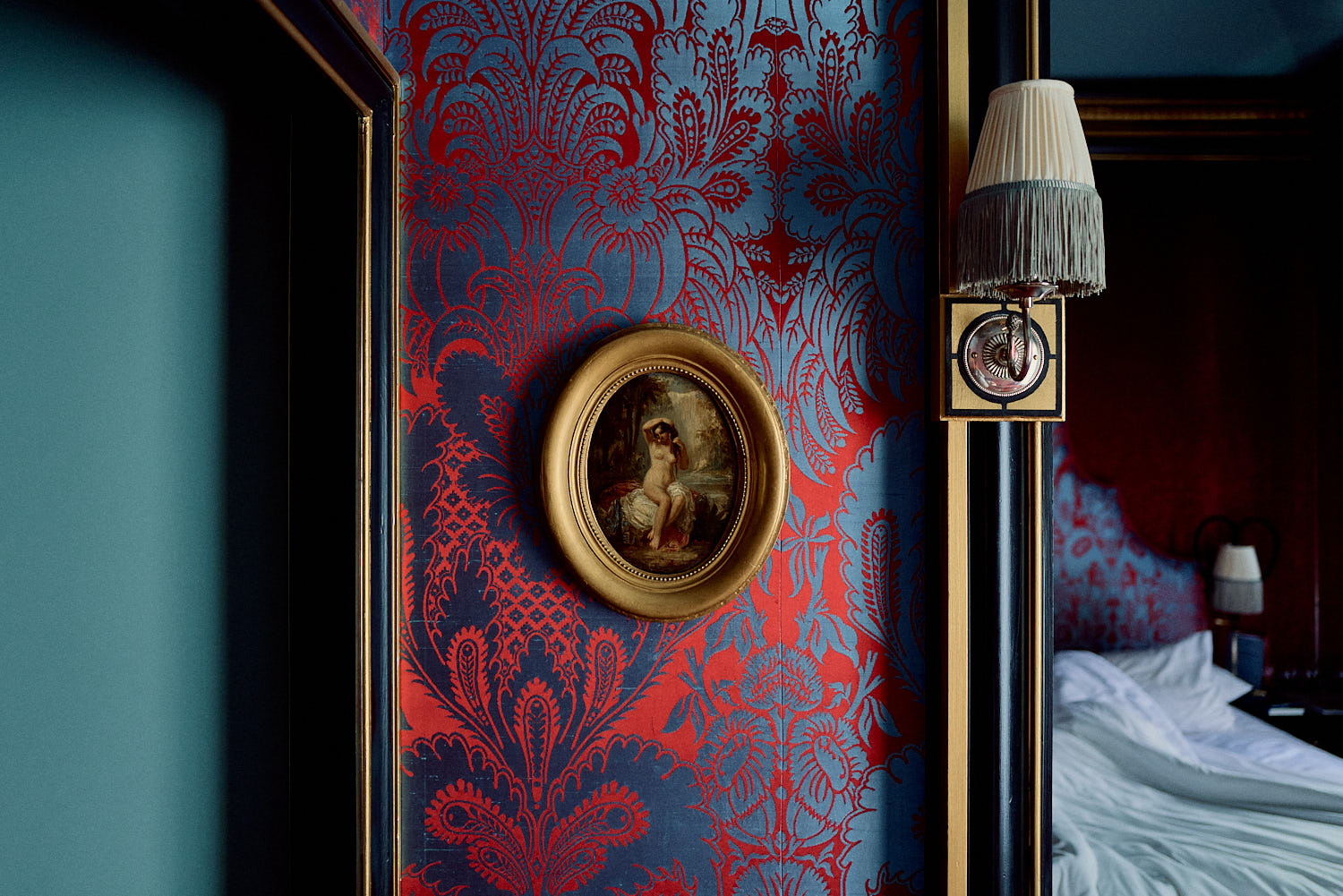 Maison Souquet More room details: courtesan winks and wallpaper that looks more red or blue depending on the light
